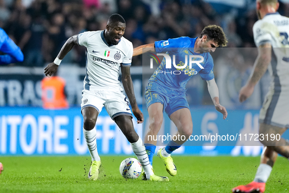 Saba Goglichidze of Empoli FC commits the red card foul on Marcus Thuram of FC Internazionale during the Serie A Enilive match between Empol...