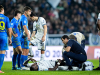 Marcus Thuram of FC Internazionale lies down injured during the Serie A Enilive match between Empoli FC and FC Internazionale at Stadio Carl...