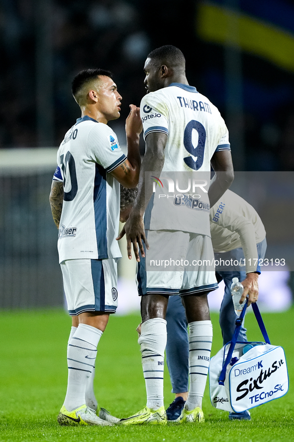 Lautaro Martinez of FC Internazionale talks to Marcus Thuram of FC Internazionale during the Serie A Enilive match between Empoli FC and FC...