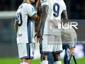 Lautaro Martinez of FC Internazionale talks to Marcus Thuram of FC Internazionale during the Serie A Enilive match between Empoli FC and FC...