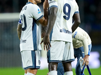 Lautaro Martinez of FC Internazionale talks to Marcus Thuram of FC Internazionale during the Serie A Enilive match between Empoli FC and FC...