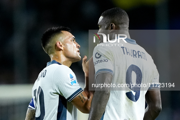 Lautaro Martinez of FC Internazionale talks to Marcus Thuram of FC Internazionale during the Serie A Enilive match between Empoli FC and FC...