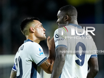 Lautaro Martinez of FC Internazionale talks to Marcus Thuram of FC Internazionale during the Serie A Enilive match between Empoli FC and FC...