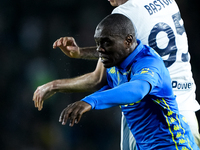 Alessandro Bastoni of FC Internazionale and Emmanuel Gyasi of Empoli FC jump for the ball during the Serie A Enilive match between Empoli FC...