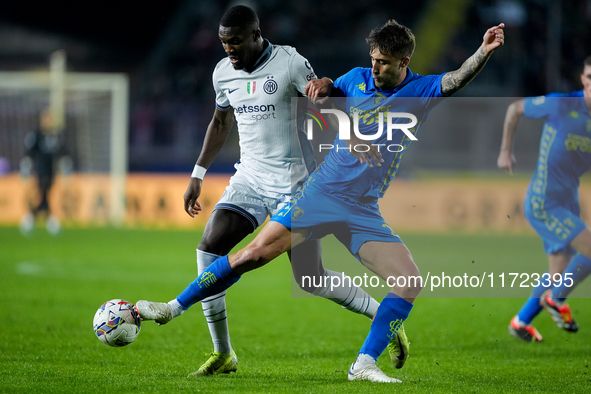 Mattia Viti of Empoli FC and Marcus Thuram of FC Internazionale compete for the ball during the Serie A Enilive match between Empoli FC and...