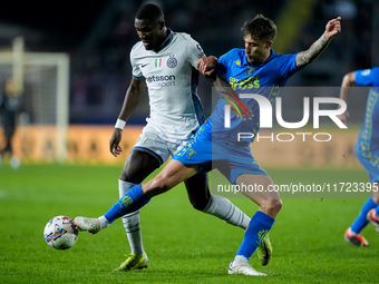 Mattia Viti of Empoli FC and Marcus Thuram of FC Internazionale compete for the ball during the Serie A Enilive match between Empoli FC and...