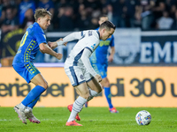 Piotr Zielinski of FC Internazionale and Jacopo Fazzini of Empoli FC compete for the ball during the Serie A Enilive match between Empoli FC...