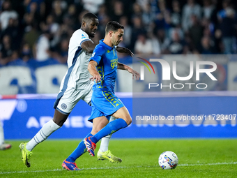 Marcus Thuram of FC Internazionale and Mattia De Sciglio of Empoli FC compete for the ball during the Serie A Enilive match between Empoli F...