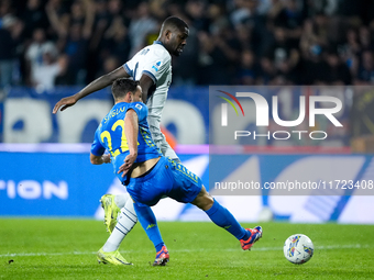 Marcus Thuram of FC Internazionale and Mattia De Sciglio of Empoli FC compete for the ball during the Serie A Enilive match between Empoli F...