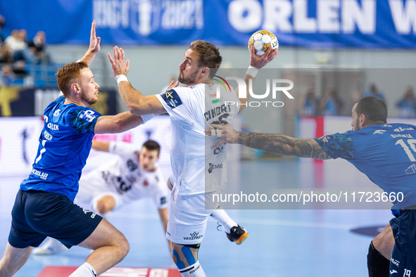 Tomas Piroch, Luka Cindric and Leon Susnja  are playing during the match EHF Champions League Men match between  Orlen Wisla Plock and Veszp...