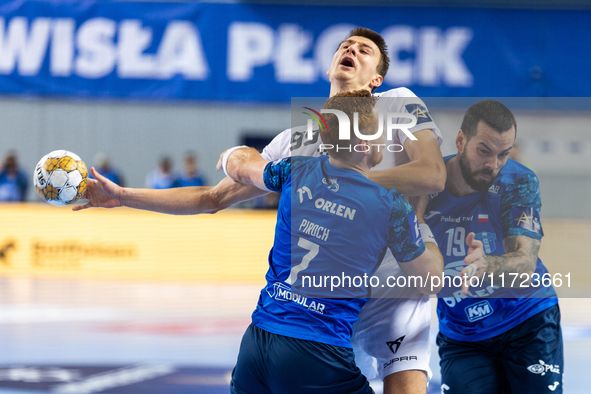 Tomas Piroch, Sergei Mark Kosorotov and Leon Susnja  are playing during the match EHF Champions League Men match between  Orlen Wisla Plock...