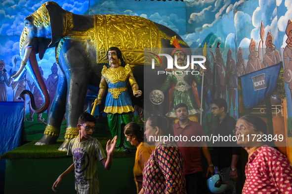 People visit a pandal during the Kali Puja festival in Kolkata, India, on October 30, 2024. 