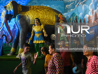 People visit a pandal during the Kali Puja festival in Kolkata, India, on October 30, 2024. (