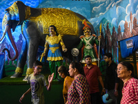 People visit a pandal during the Kali Puja festival in Kolkata, India, on October 30, 2024. (