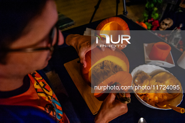 People carve their pumpkins to get ready for Halloween in The Netherlands, on October 30, 2024. 