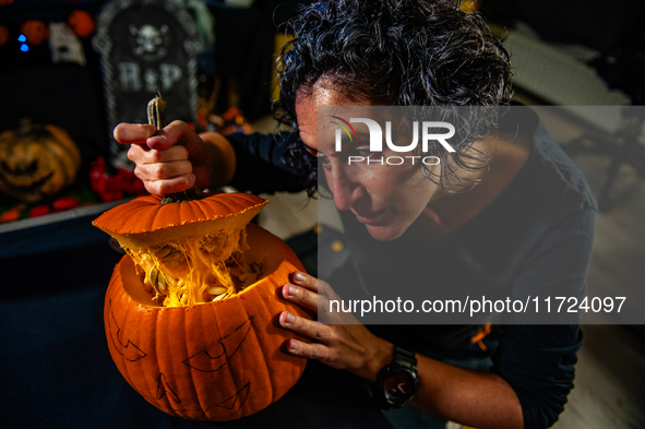 People carve their pumpkins to get ready for Halloween in The Netherlands, on October 30, 2024. 