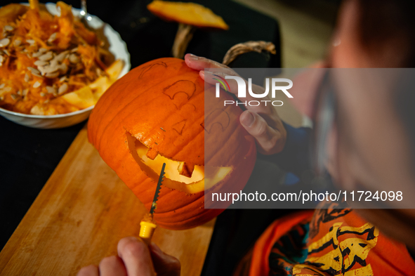 People carve their pumpkins to get ready for Halloween in The Netherlands, on October 30, 2024. 