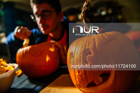 People carve their pumpkins to get ready for Halloween in The Netherlands, on October 30, 2024. 