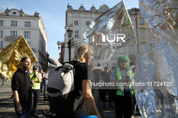 Participants in a protest against the suspension of asylum law under the slogan 'Fuck your borders' gather at the Main Square in Krakow, Pol...