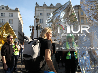 Participants in a protest against the suspension of asylum law under the slogan 'Fuck your borders' gather at the Main Square in Krakow, Pol...