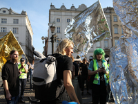 Participants in a protest against the suspension of asylum law under the slogan 'Fuck your borders' gather at the Main Square in Krakow, Pol...