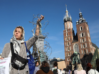 Participants in a protest against the suspension of asylum law under the slogan 'Fuck your borders' gather at the Main Square in Krakow, Pol...