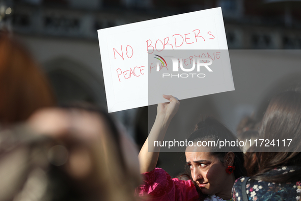 Participants in a protest against the suspension of asylum law under the slogan 'Fuck your borders' gather at the Main Square in Krakow, Pol...