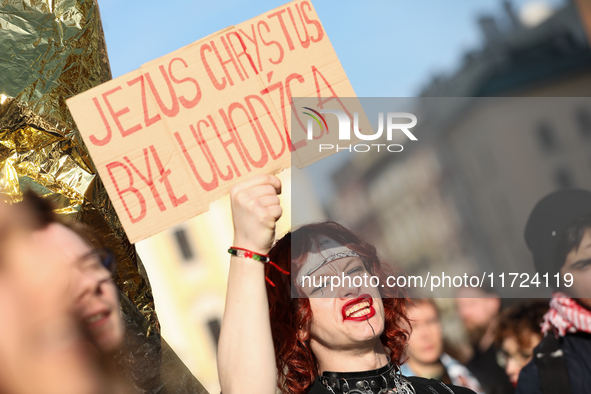 Participants in a protest against the suspension of asylum law under the slogan 'Fuck your borders' gather at the Main Square in Krakow, Pol...