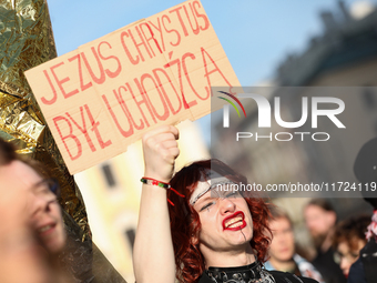 Participants in a protest against the suspension of asylum law under the slogan 'Fuck your borders' gather at the Main Square in Krakow, Pol...