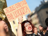 Participants in a protest against the suspension of asylum law under the slogan 'Fuck your borders' gather at the Main Square in Krakow, Pol...