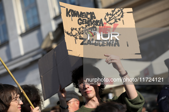 Participants in a protest against the suspension of asylum law under the slogan 'Fuck your borders' gather at the Main Square in Krakow, Pol...