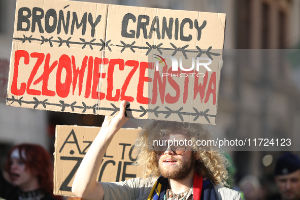 Participants of the protest against the suspension of asylum law under the slogan 'Fuck your borders' walk through the streets of the city i...