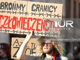 Participants of the protest against the suspension of asylum law under the slogan 'Fuck your borders' walk through the streets of the city i...