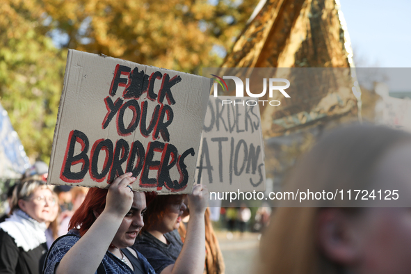 Participants of the protest against the suspension of asylum law under the slogan 'Fuck your borders' walk through the streets of the city i...