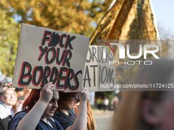 Participants of the protest against the suspension of asylum law under the slogan 'Fuck your borders' walk through the streets of the city i...