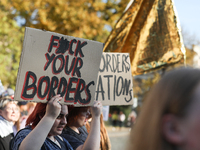 Participants of the protest against the suspension of asylum law under the slogan 'Fuck your borders' walk through the streets of the city i...