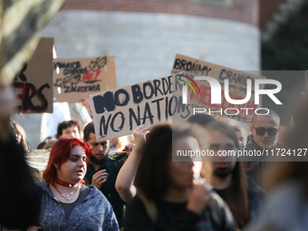 Participants of the protest against the suspension of asylum law under the slogan 'Fuck your borders' walk through the streets of the city i...