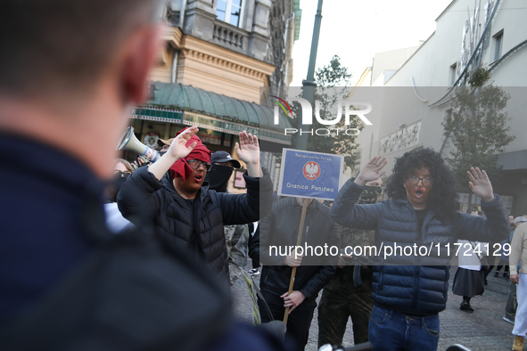 Participants of the counter-demonstration organized by the All-Polish Youth dress as refugees in blackface, and Polish soldiers point rifles...