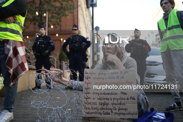 Participants protest against the suspension of asylum law under the slogan 'Fuck your borders' outside the Civic Platform office in Krakow,...