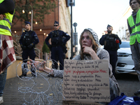 Participants protest against the suspension of asylum law under the slogan 'Fuck your borders' outside the Civic Platform office in Krakow,...