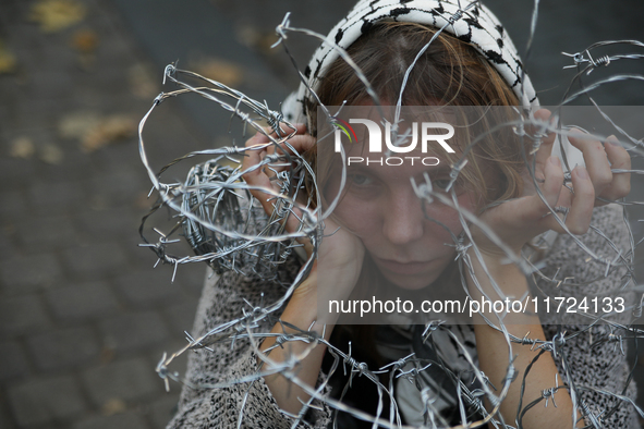 Participants protest against the suspension of asylum law under the slogan 'Fuck your borders' outside the Civic Platform office in Krakow,...