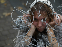 Participants protest against the suspension of asylum law under the slogan 'Fuck your borders' outside the Civic Platform office in Krakow,...