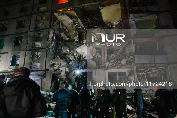 Rescue services are at the scene of the impact, following a Russian airstrike in Kharkiv, Ukraine, on October 30, 2024, a bomb struck a resi...