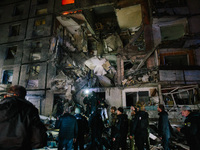 Rescue services are at the scene of the impact, following a Russian airstrike in Kharkiv, Ukraine, on October 30, 2024, a bomb struck a resi...