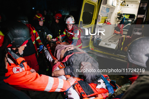 The victim is unblocked from under the rubble, following a Russian airstrike in Kharkiv, Ukraine, on October 30, 2024, a bomb struck a resid...