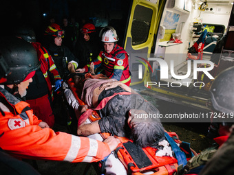 The victim is unblocked from under the rubble, following a Russian airstrike in Kharkiv, Ukraine, on October 30, 2024, a bomb struck a resid...