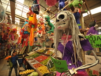 A cardboard skull is seen at a market in the municipality of San Juan del Rio. Local market vendors offer items to decorate the offerings, s...