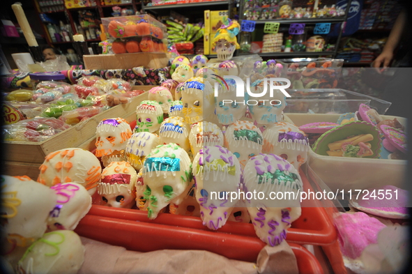 Sugar skulls, known as calaverita de azucar, are seen at a stand inside a market in the municipality of San Juan del Rio. Local market vendo...