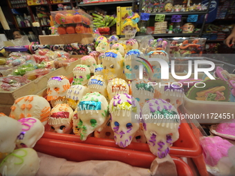 Sugar skulls, known as calaverita de azucar, are seen at a stand inside a market in the municipality of San Juan del Rio. Local market vendo...