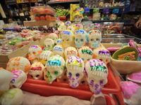 Sugar skulls, known as calaverita de azucar, are seen at a stand inside a market in the municipality of San Juan del Rio. Local market vendo...